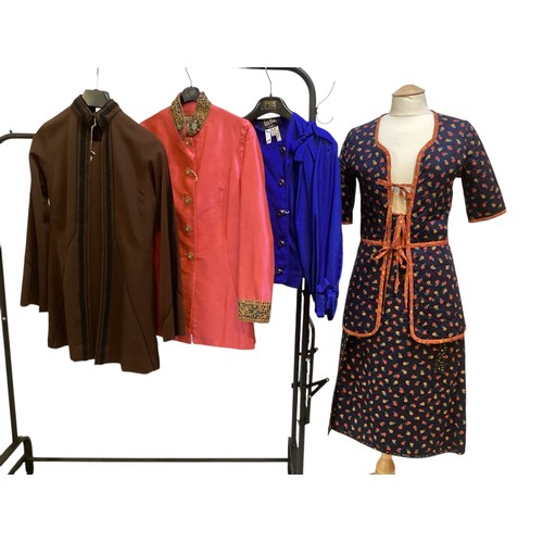 28 - A quantity of various clothes to include a THEA PORTER brown trouser suit with black braiding to tro... 