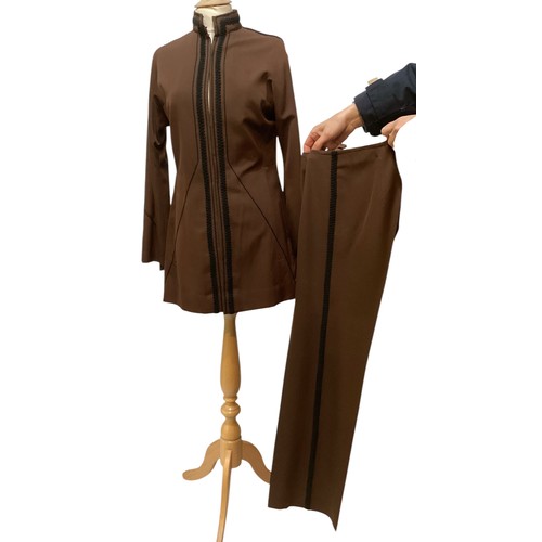 28 - A quantity of various clothes to include a THEA PORTER brown trouser suit with black braiding to tro... 