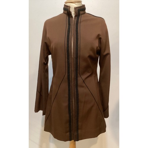 28 - A quantity of various clothes to include a THEA PORTER brown trouser suit with black braiding to tro... 