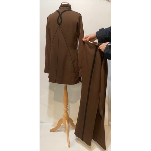 28 - A quantity of various clothes to include a THEA PORTER brown trouser suit with black braiding to tro... 