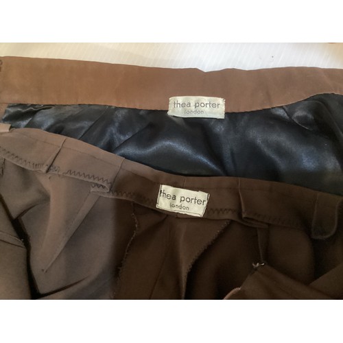 28 - A quantity of various clothes to include a THEA PORTER brown trouser suit with black braiding to tro... 