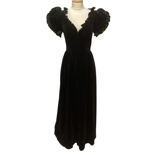 29 - A GINA FRATINI black cotton velvet evening dress with frill trim around neck and short sleeves. Labe... 