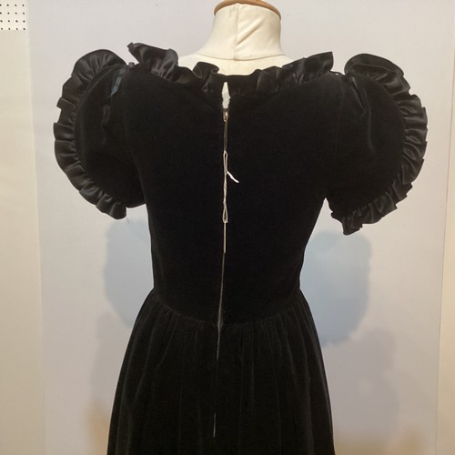 29 - A GINA FRATINI black cotton velvet evening dress with frill trim around neck and short sleeves. Labe... 