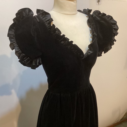 29 - A GINA FRATINI black cotton velvet evening dress with frill trim around neck and short sleeves. Labe... 