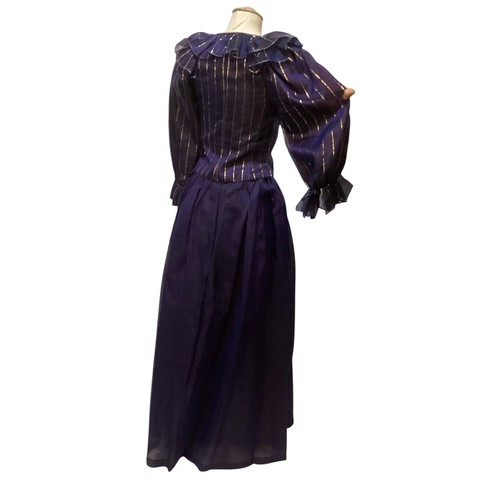 31 - CAROLINE CHARLES, a purple silk skirt and shirt with gold thread pattern, labelled  European size  3... 