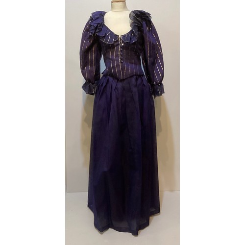 31 - CAROLINE CHARLES, a purple silk skirt and shirt with gold thread pattern, labelled  European size  3... 