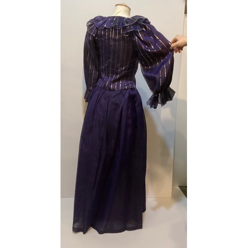 31 - CAROLINE CHARLES, a purple silk skirt and shirt with gold thread pattern, labelled  European size  3... 