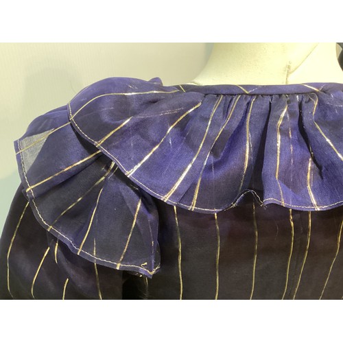 31 - CAROLINE CHARLES, a purple silk skirt and shirt with gold thread pattern, labelled  European size  3... 