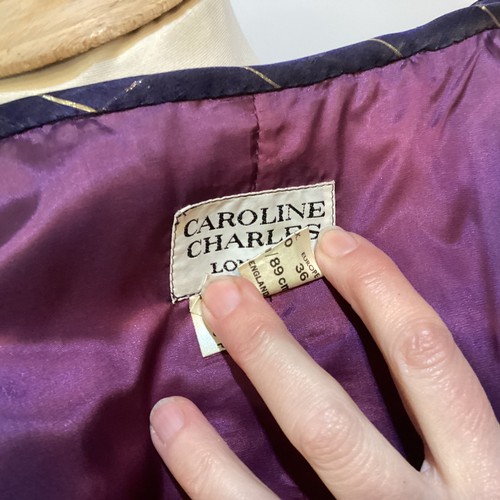 31 - CAROLINE CHARLES, a purple silk skirt and shirt with gold thread pattern, labelled  European size  3... 