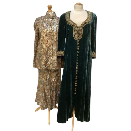 32 - CAROLINE CHARLES a long green velvet coat dress with gold braid around neck and cuffs with gold butt... 