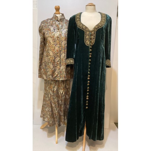 32 - CAROLINE CHARLES a long green velvet coat dress with gold braid around neck and cuffs with gold butt... 