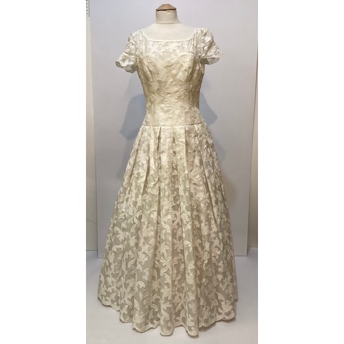 33 - Three ball dresses to include a 1980's cream ESCADA Couture dress and separate underskirt, (damage t... 