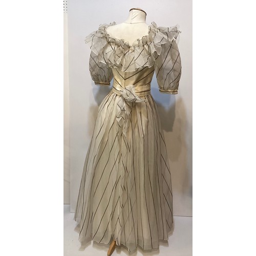 33 - Three ball dresses to include a 1980's cream ESCADA Couture dress and separate underskirt, (damage t... 