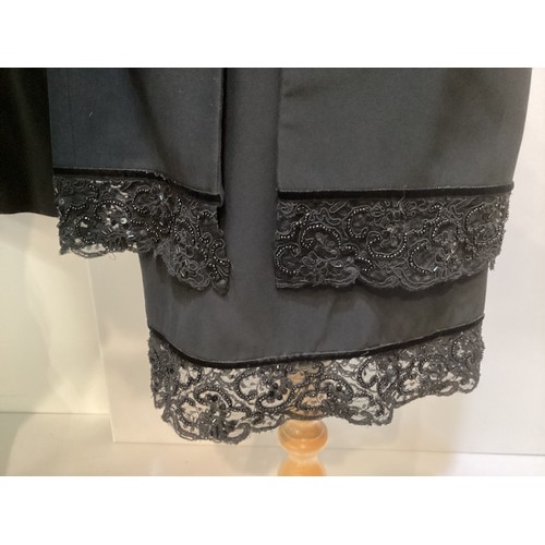 35 - WIM HEMMINK:  1980's, a black suit with bead embroidered lace to skirt and jacket with black buttons... 