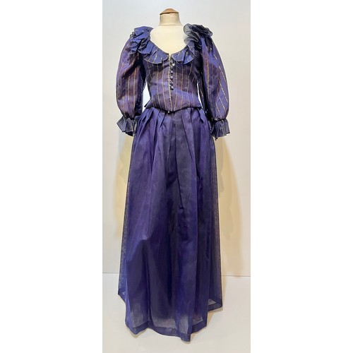 31 - CAROLINE CHARLES, a purple silk skirt and shirt with gold thread pattern, labelled  European size  3... 