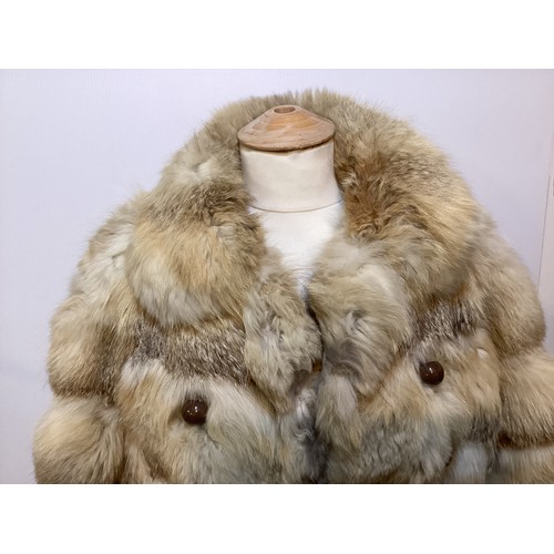 86 - A short fur coat, lined, some minor marks to lining, and a long fur coat with wear and losses to fro... 