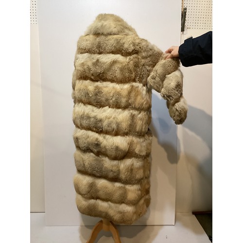 86 - A short fur coat, lined, some minor marks to lining, and a long fur coat with wear and losses to fro... 