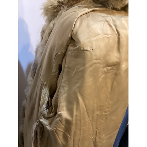 86 - A short fur coat, lined, some minor marks to lining, and a long fur coat with wear and losses to fro... 