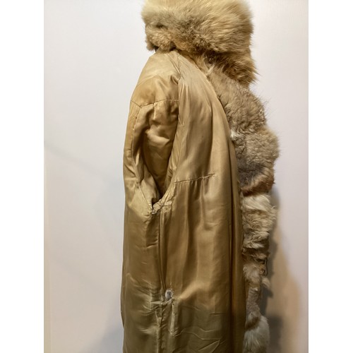 86 - A short fur coat, lined, some minor marks to lining, and a long fur coat with wear and losses to fro... 