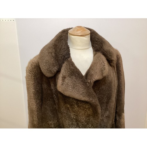 94 - A long brown beaver and mixed fiber coat with matching hat. 70's, condition: holes where label has b... 