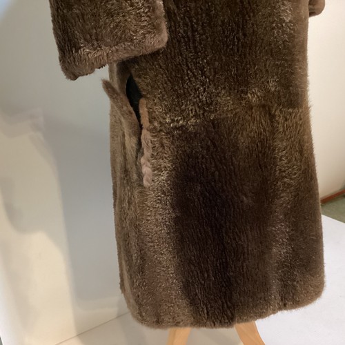 94 - A long brown beaver and mixed fiber coat with matching hat. 70's, condition: holes where label has b... 