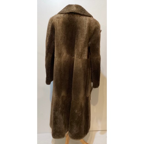 94 - A long brown beaver and mixed fiber coat with matching hat. 70's, condition: holes where label has b... 