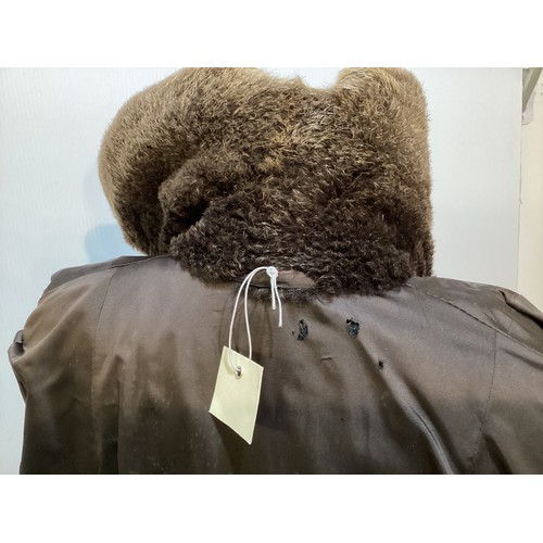 94 - A long brown beaver and mixed fiber coat with matching hat. 70's, condition: holes where label has b... 