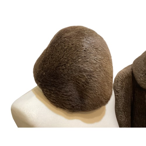 94 - A long brown beaver and mixed fiber coat with matching hat. 70's, condition: holes where label has b... 