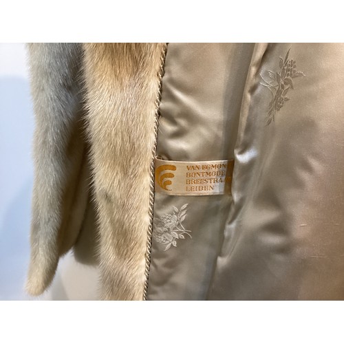 95 - Two fur coats: one short cream mink labelled Van Egmond Bontmode Breestraat Leiden, and a long brown... 