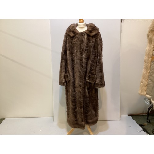 95 - Two fur coats: one short cream mink labelled Van Egmond Bontmode Breestraat Leiden, and a long brown... 