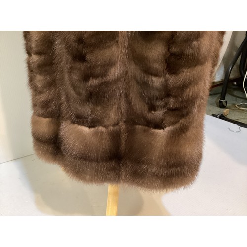 95 - Two fur coats: one short cream mink labelled Van Egmond Bontmode Breestraat Leiden, and a long brown... 