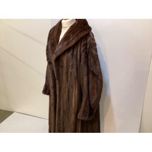 96 - A long brown fur coat with balloon sleeves and large shawl style collar. Monogrammed MAR. Condition ... 