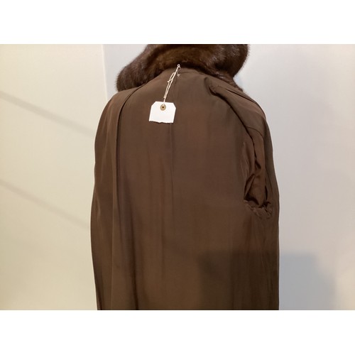 96 - A long brown fur coat with balloon sleeves and large shawl style collar. Monogrammed MAR. Condition ... 