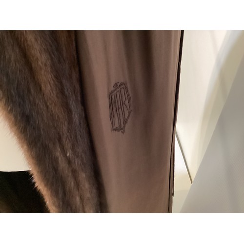 96 - A long brown fur coat with balloon sleeves and large shawl style collar. Monogrammed MAR. Condition ... 