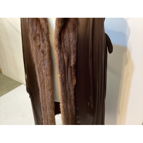 97 - A 3/4 length brown fur coat, condition: slight wear to fur at pockets and marks to hem lining.