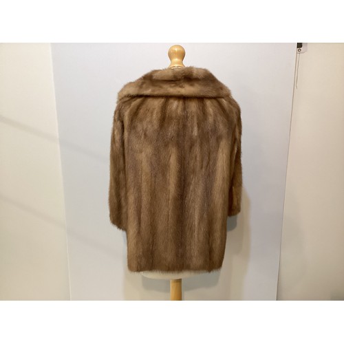 98 - A short light brown fur coat, with 3/4 sleeves. Condition: no sign of damage.