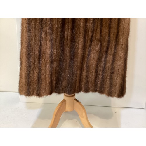 99 - A 3/4 length brown fur coat, labelled VLADIMIR OLISSOFF Condition: sign of wear and a split on shoul... 