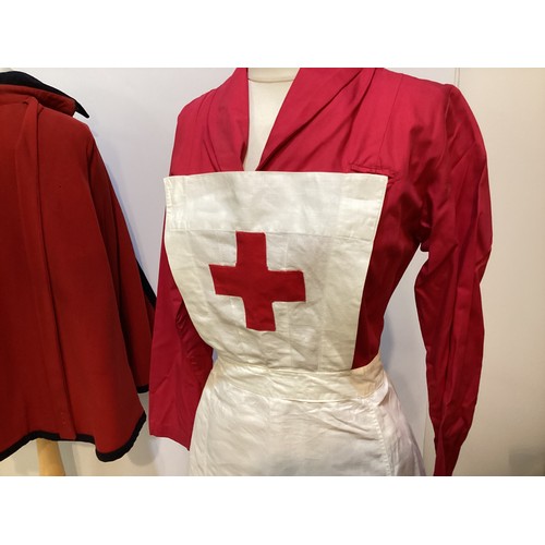 64 - A 1950's Red Cross Nurse uniform.  BRCS Supply Dep Grosvenor Crescent London. A red nurses dress , a... 