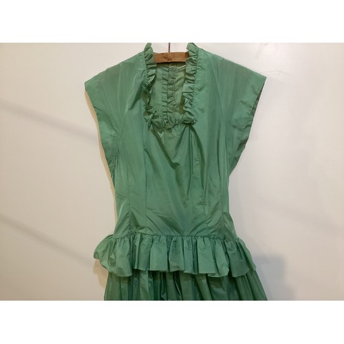 106 - A long green dress made from parachute fabric, during the WW2, and worn by the vendors' grandmother,... 