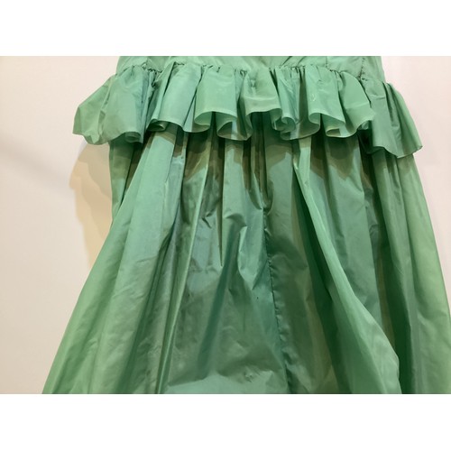 106 - A long green dress made from parachute fabric, during the WW2, and worn by the vendors' grandmother,... 