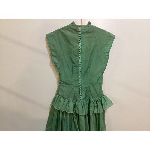 106 - A long green dress made from parachute fabric, during the WW2, and worn by the vendors' grandmother,... 