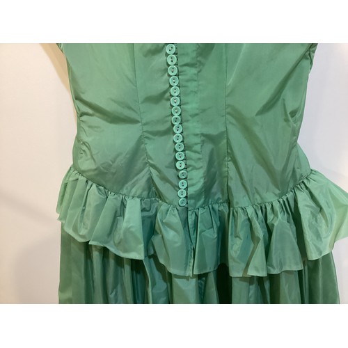 106 - A long green dress made from parachute fabric, during the WW2, and worn by the vendors' grandmother,... 