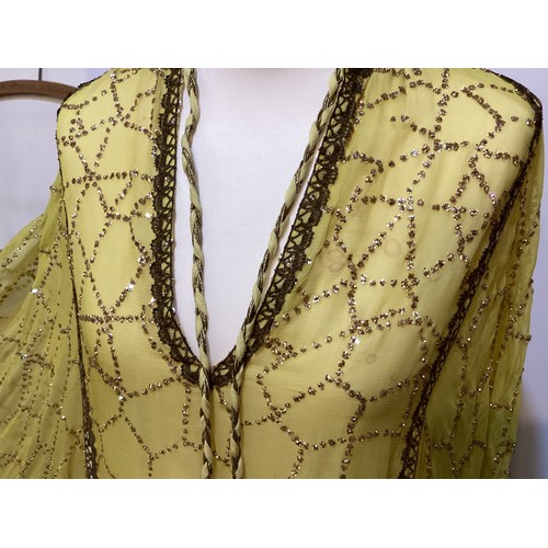 107 - THEO PORTER 1970's yellow kaftan dress with all over beading and tie belt, labelled Theo Porter Cout... 