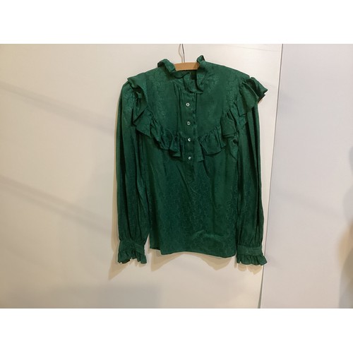 108 - SAINT LAURENT - two tops - green silk shirt with tie and ruffles, labelled 38, a black lace shirt wi... 