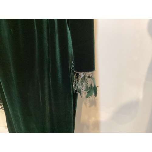 111 - ULRICH ENGLER green velvet long dress with silk pleated band to waist and feather and bead trim to c... 