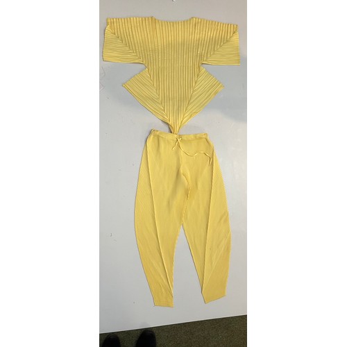 153 - ISSEY MIYAKE a black pleated top, ISSEY MIYAKE PLEATS PLEASE gold long cardigan coat, MASHIAH pleate... 