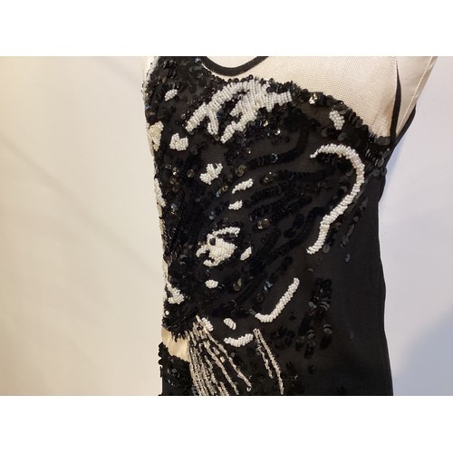 156 - KRIZIA a black and white knitted dress, embellished with sequin beaded bodice illustrating a leopard... 