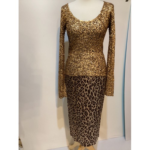 161 - A quantity of clothes to include A DONNA KAREN gold sequin and black top, a DOLCE & GABBANA animal p... 