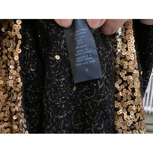 161 - A quantity of clothes to include A DONNA KAREN gold sequin and black top, a DOLCE & GABBANA animal p... 