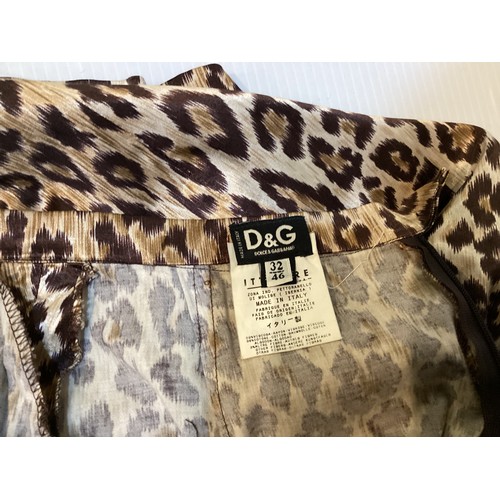 161 - A quantity of clothes to include A DONNA KAREN gold sequin and black top, a DOLCE & GABBANA animal p... 